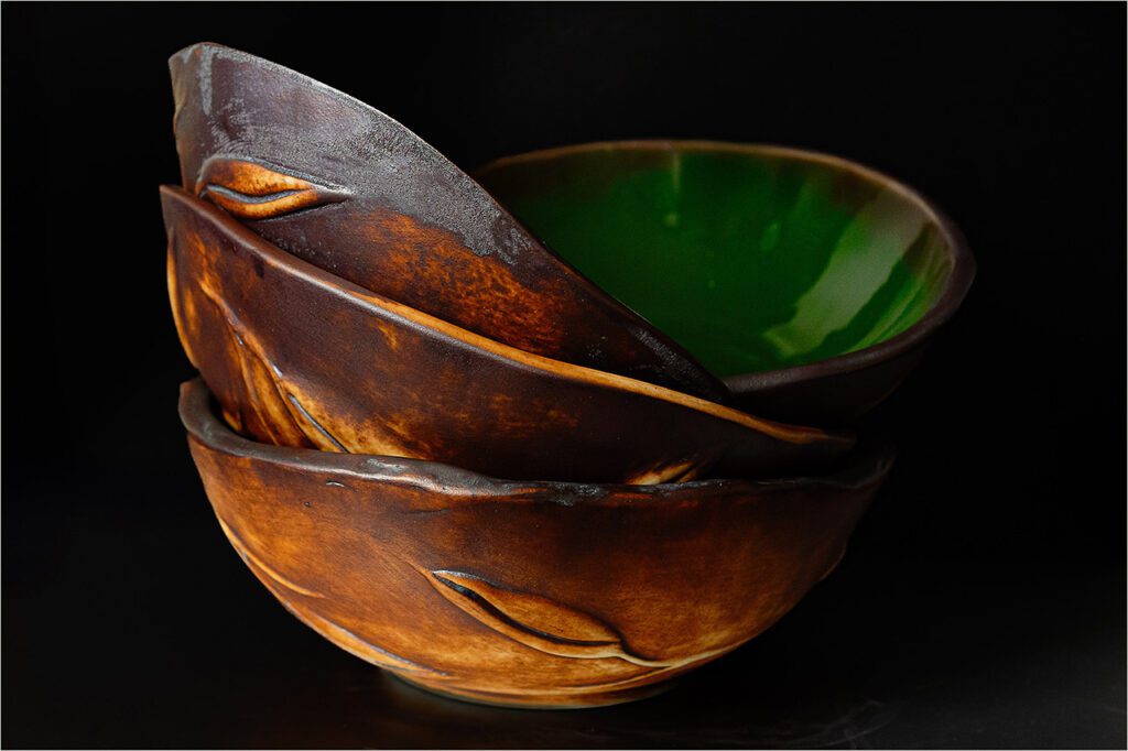 stack of emerald, green handmade porcelain bowls by Leona Darnell