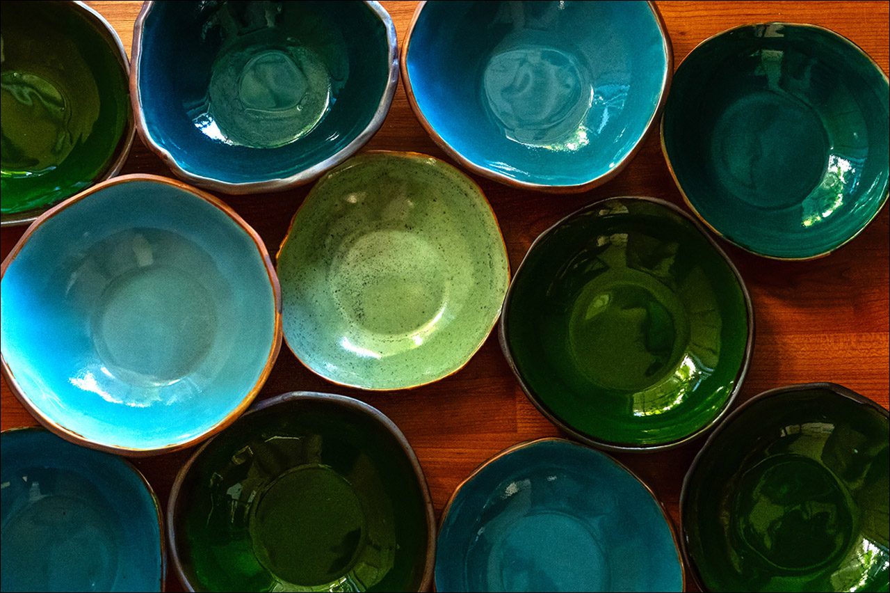An array of handmade, nature-inspired porcelain bowls. Made by Leona Darnell.